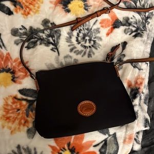 Dooney&Bourke adjustable strap Purse w/ Black&Brown exterior & w/RED interior.